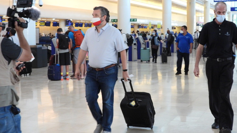 Ted Cruz (R-TX) checking in for a flight at Cancun International Airport after a backlash over his Mexican family vacation as his home state of Texas endured a Winter storm