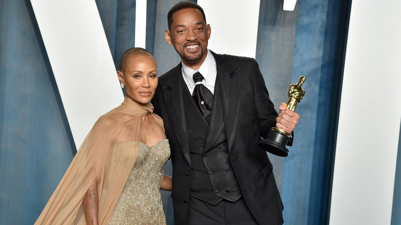 Will Smith, and Jada Pinkett Smith, both smiling