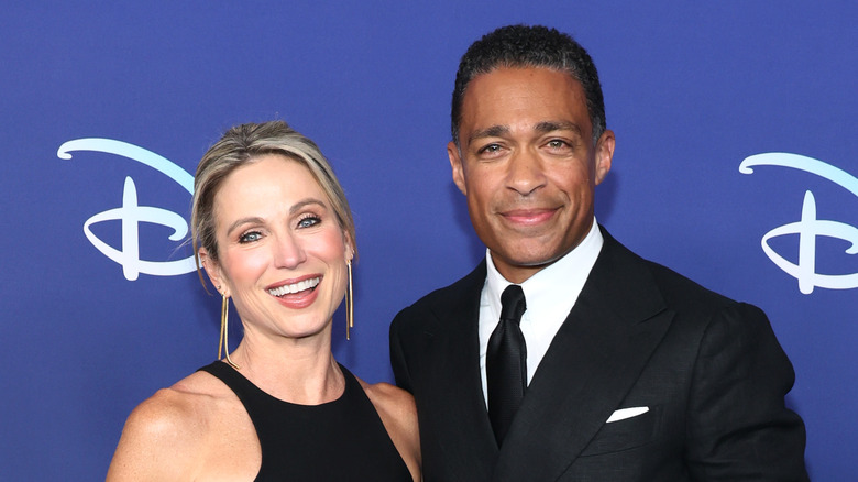 Amy Robach and T.J. Holmes smiling