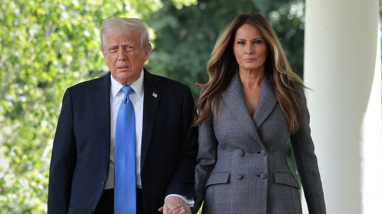 Donald Trump and Melania Trump holding hands