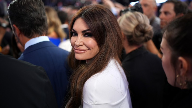 Kimberly Guilfoyle smiling over shoulder