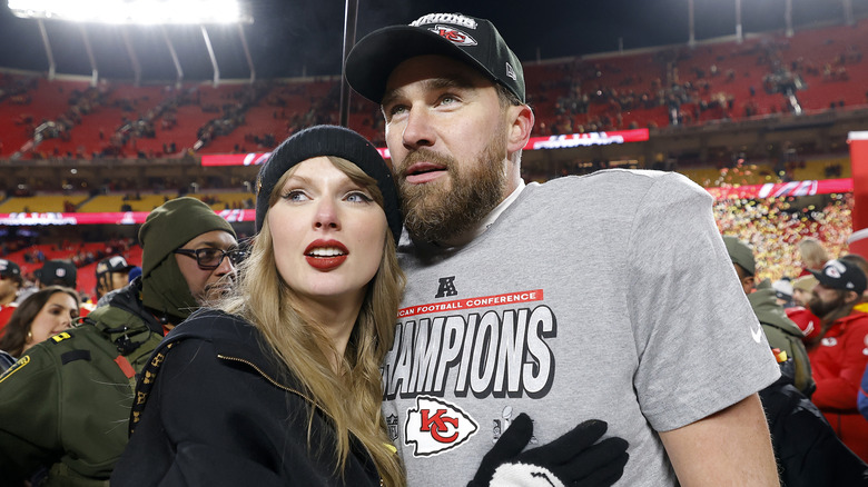 Taylor Swift hugging Travis Kelce