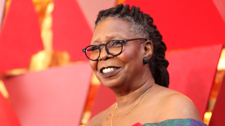 Whoopi Goldberg smiles