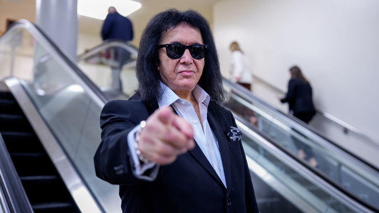 Gene Simmons points to a photographer while on Capitol Hill.