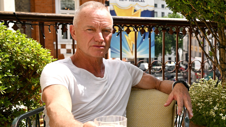 Sting pictured with a drink.