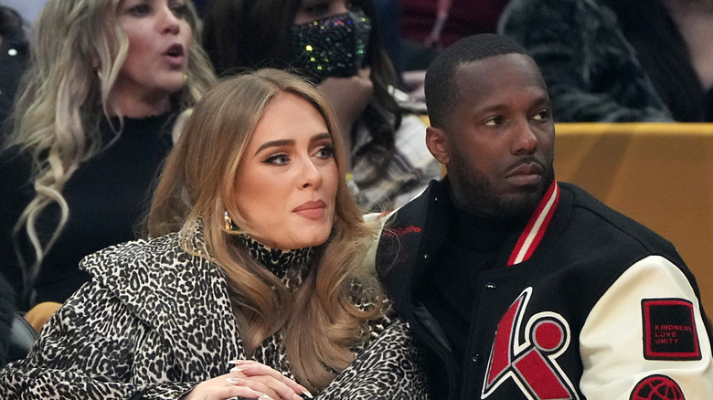Adele and Rich Paul sit courtside at an NBA game