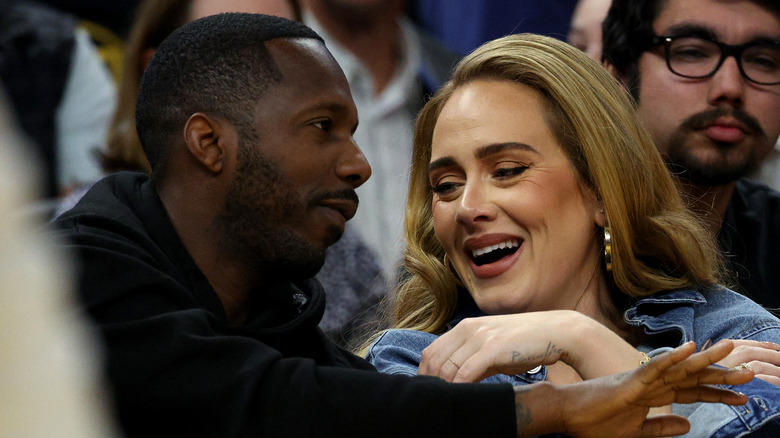 Adele and Rich Paul sit courtside at an NBA game