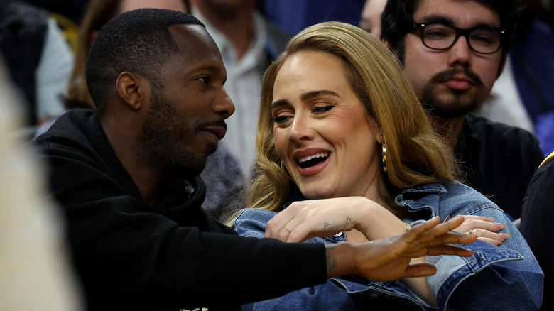 Adele and Rich Paul sit courtside at an NBA game