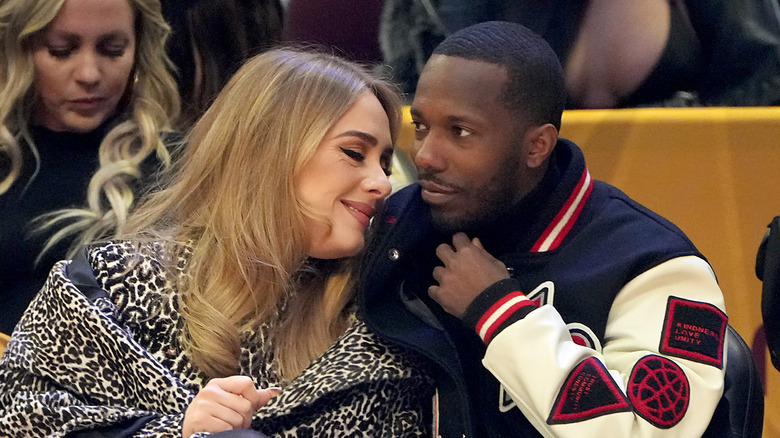 Adele and Rich Paul sit courtside at an NBA game