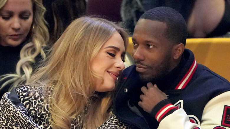 Adele and Rich Paul sit courtside at an NBA game