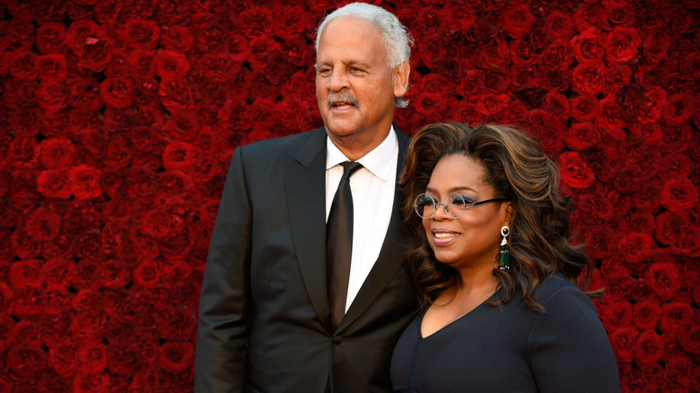 Oprah and Stedman Graham posing together on the red carpet.
