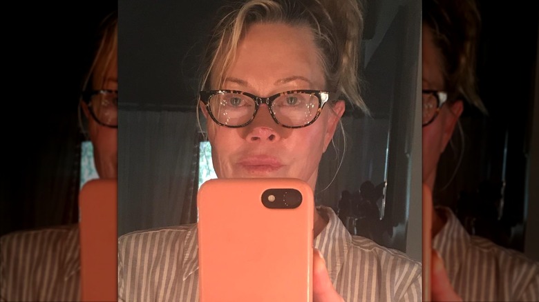 Melanie Griffith taking a close-up mirror selfie.