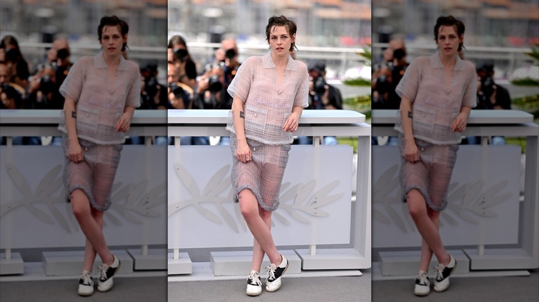 Kristen Stewart leaning against a railing at Cannes 2026.