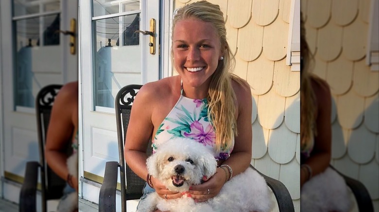 Karoline Leavitt holding a dog