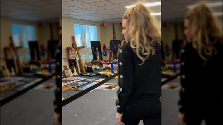 Erika Kirk looks at tributes to Charlie Kirk sent by fans of Turning Point USA.