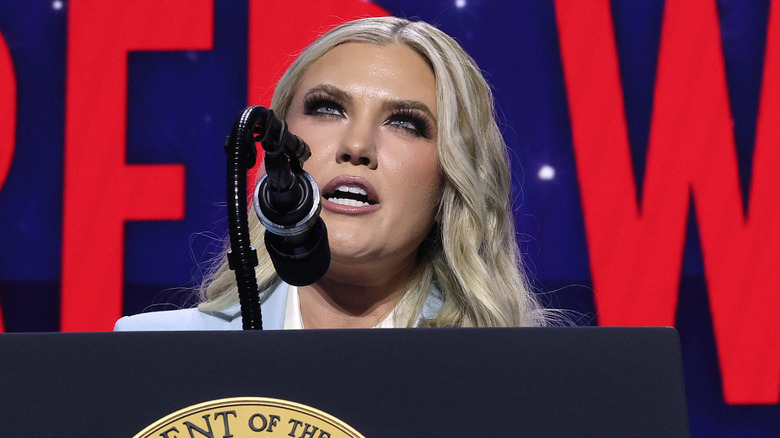 Erika Kirk talking into a microphone