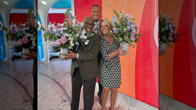Dylan Dreyer, Al Roker, and Craig Melvin posing with flowers