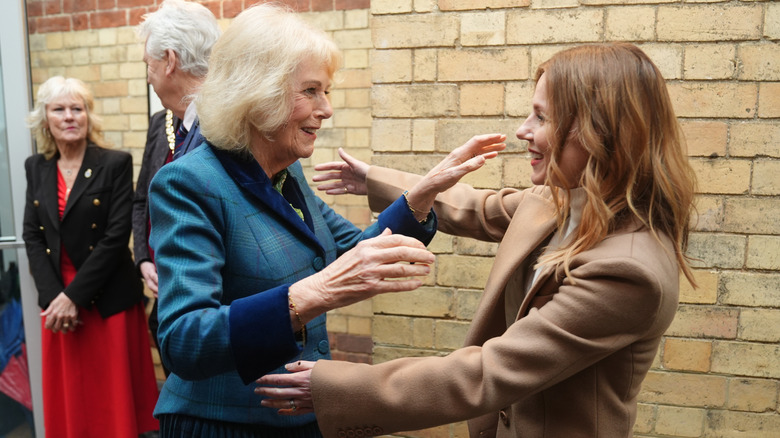 Queen Camilla hugs Geri Halliwell at a charity event