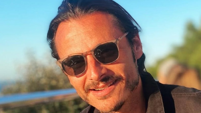 Charles Martins wearing sunglasses on a terrace in South West France