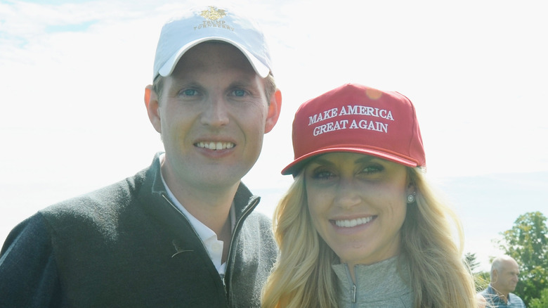 Eric Trump on golf course with Lara Trump