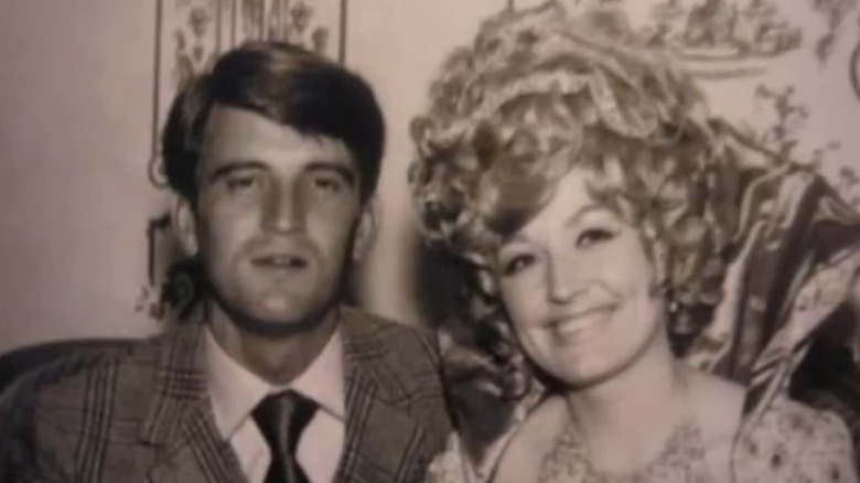 Carl Dean and Dolly Parton posing together.