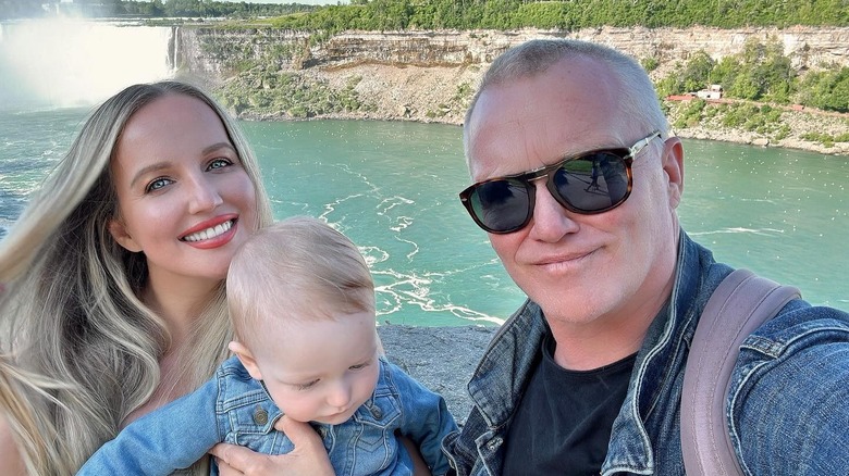 Anthony Michael Hall and Lucia Oskerova pose with their son at Niagara Falls