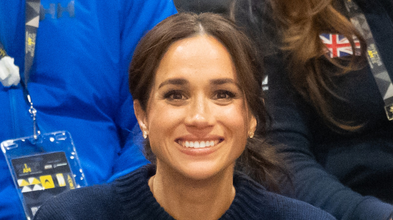 Meghan Markle smiles for a photo