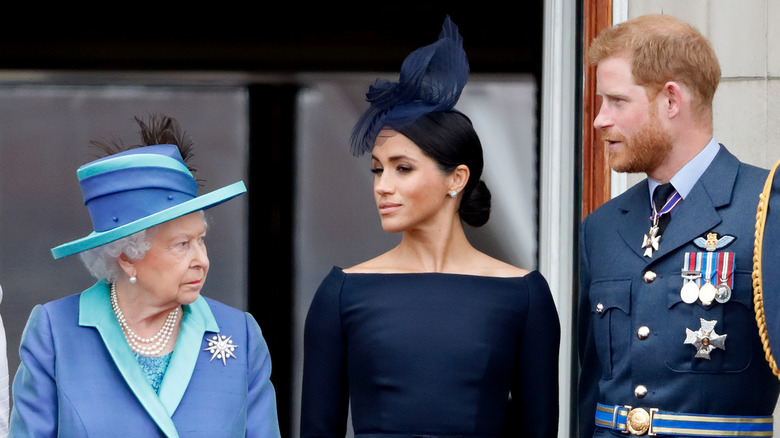 Queen Elizabeth, Meghan Markle, and Prince Harry at Buckingham Palace