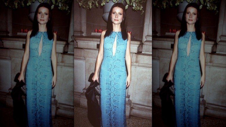 Gwyneth Paltrow at the 1999 Met Gala in a blue snakesin dress with a keyhole cutout.