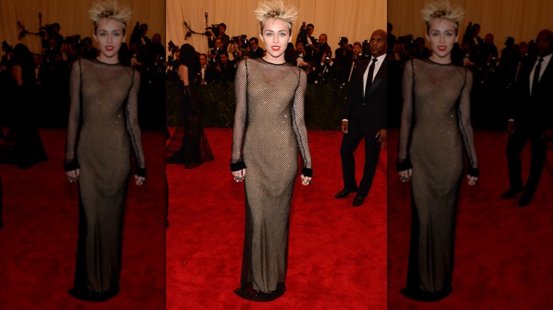 Miley Cyrus at the 2013 Met Gala in a sparkly black mesh dress.