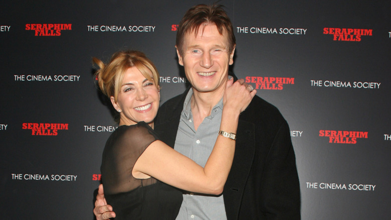 Natasha Richardson and Liam Neeson hug at a screening for 