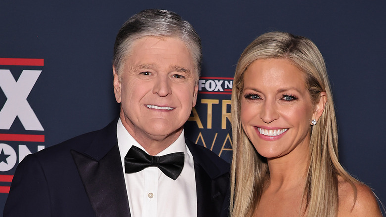 Sean Hannity and Ainsley Earhardt pose at a Fox News event in December 2024