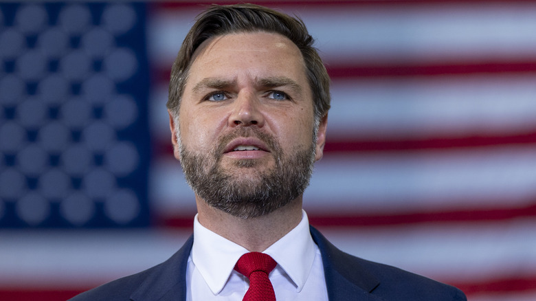 JD Vance speaking in front of the American flag