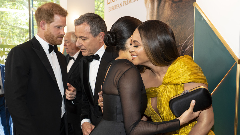 Prince Harry and Meghan Markle with Bob Iger and Beyonce at The Lion King premiere.