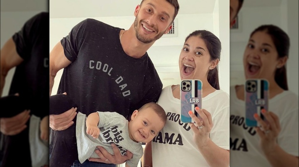 Loren and Alexei Brovarnik and baby take a selfie