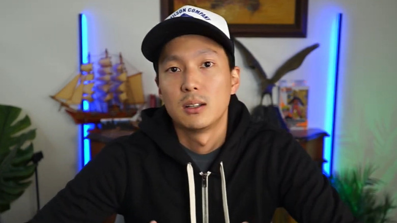 Still of Topher Park talking to the camera