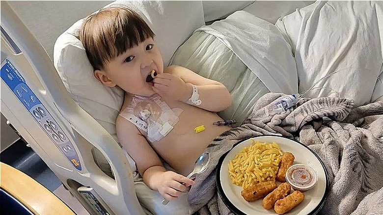 Taeyang Clegg Lee lying in hospital bed