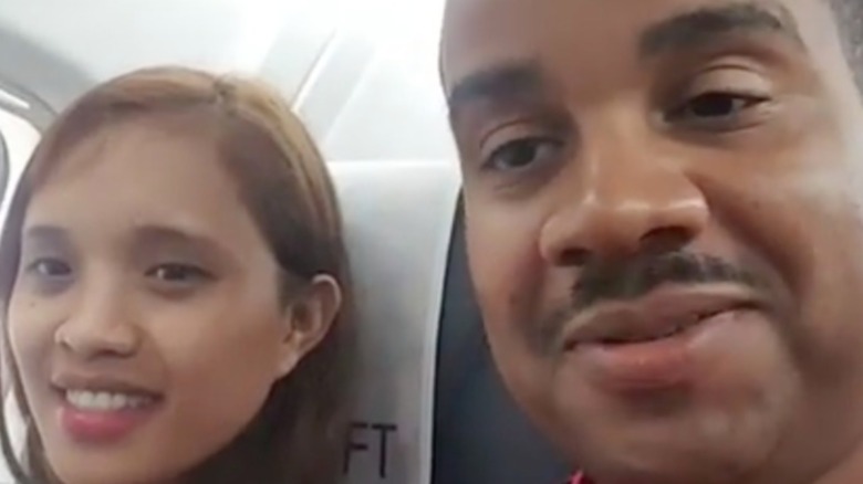 Hazel Cagalitan and Tarik Myers speak to their camera on an airplane  