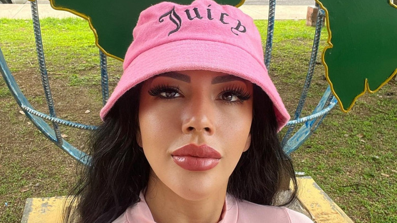 Jasmine Pineda poses in pink bucket hat in 2022