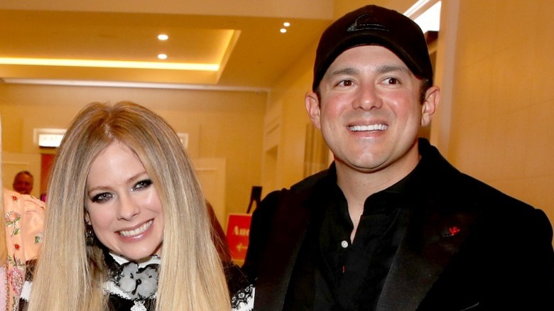 Avril Lavigne and Philip Sarofim, smiling