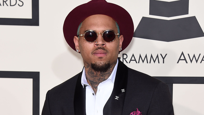 Chris Brown wearing glasses and hat