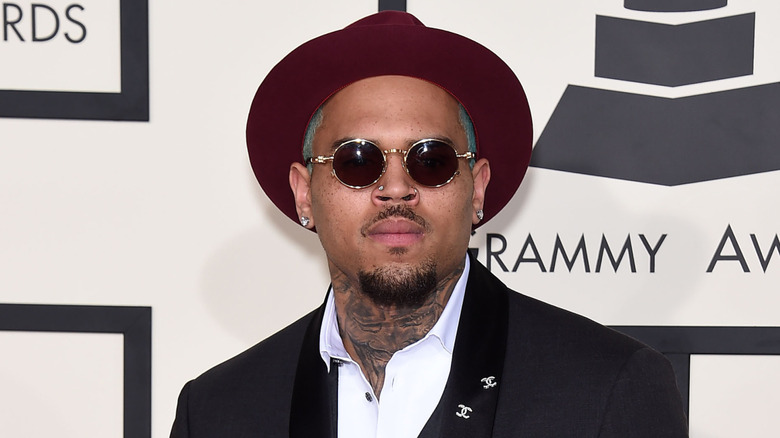 Chris Brown wearing glasses and hat