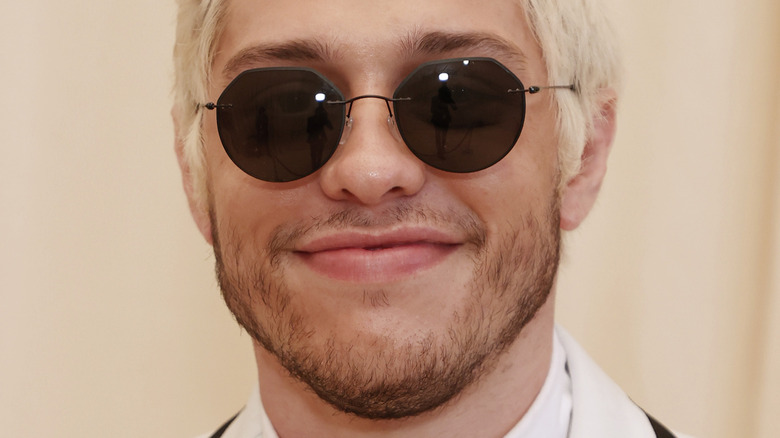 Pete Davidson smiling in sunglasses