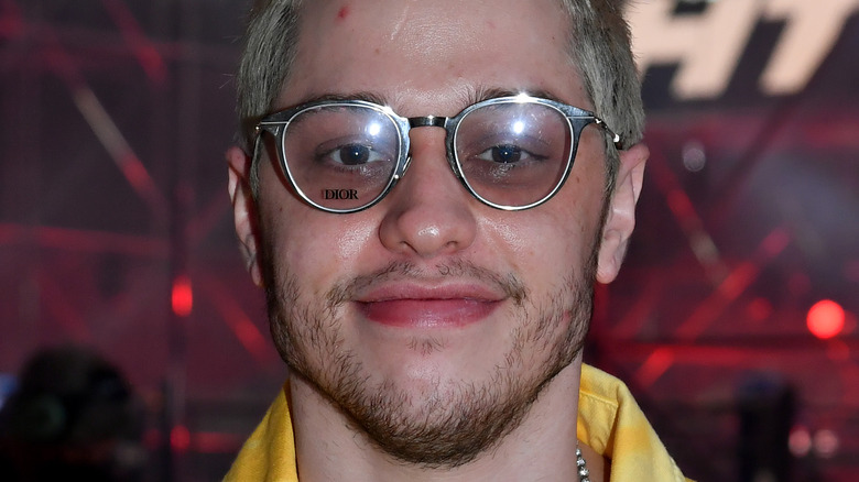 Pete Davidson wearing round glasses