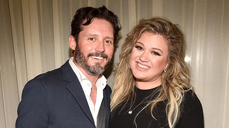 Brandon Blackstock and Kelly Clarkson smiling