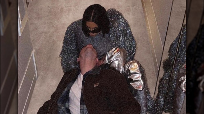 Kim Kardashian and Pete Davidson being cozy