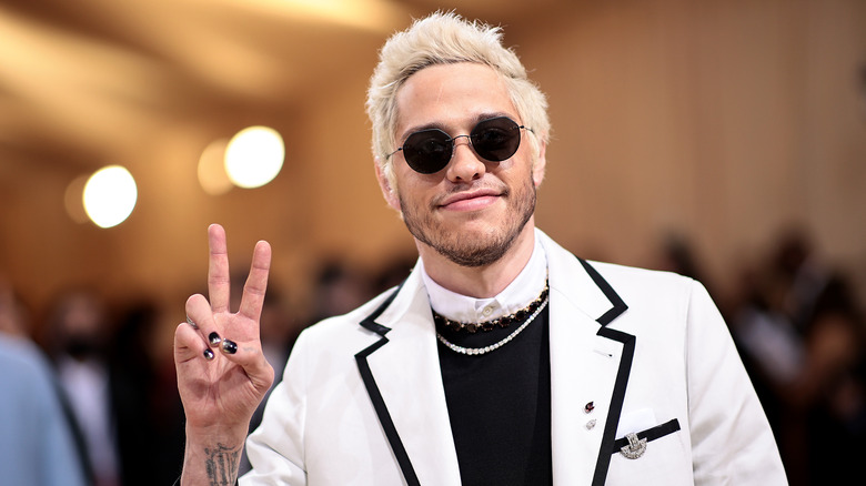 Pete Davidson at an event, wearing sunglasses
