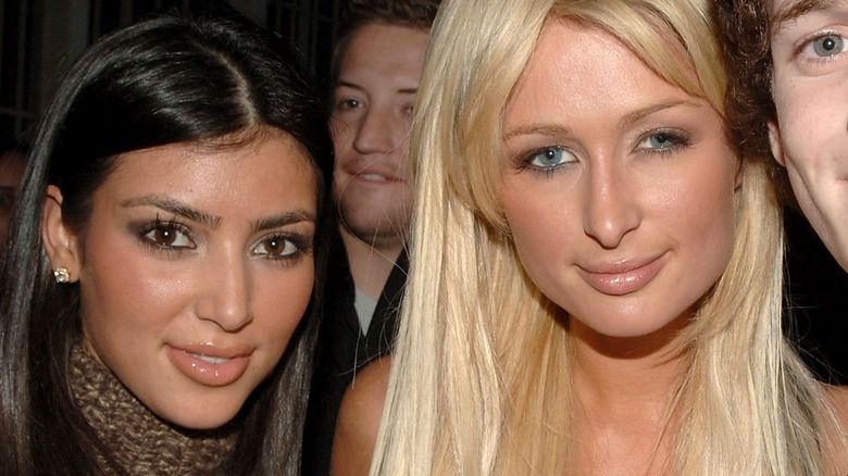 Kim Kardashian and Paris Hilton, both smiling