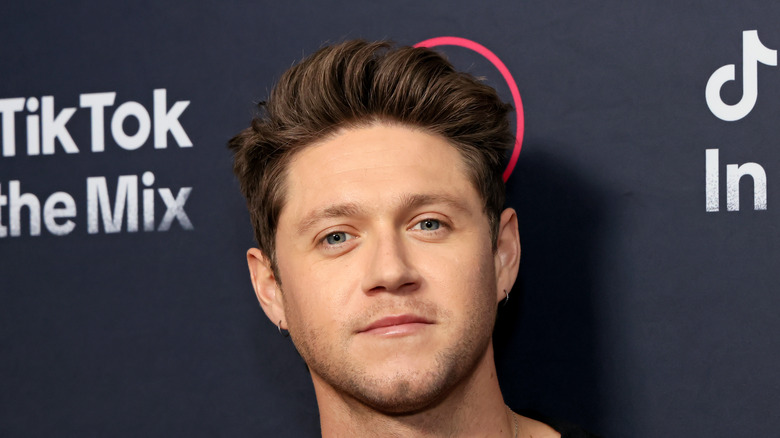 Niall Horan smiles in close-up