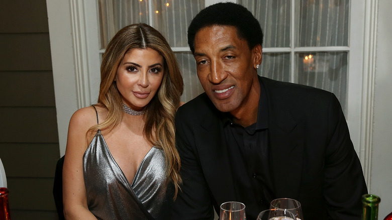 Larsa and Scottie Pippen sit together at a party